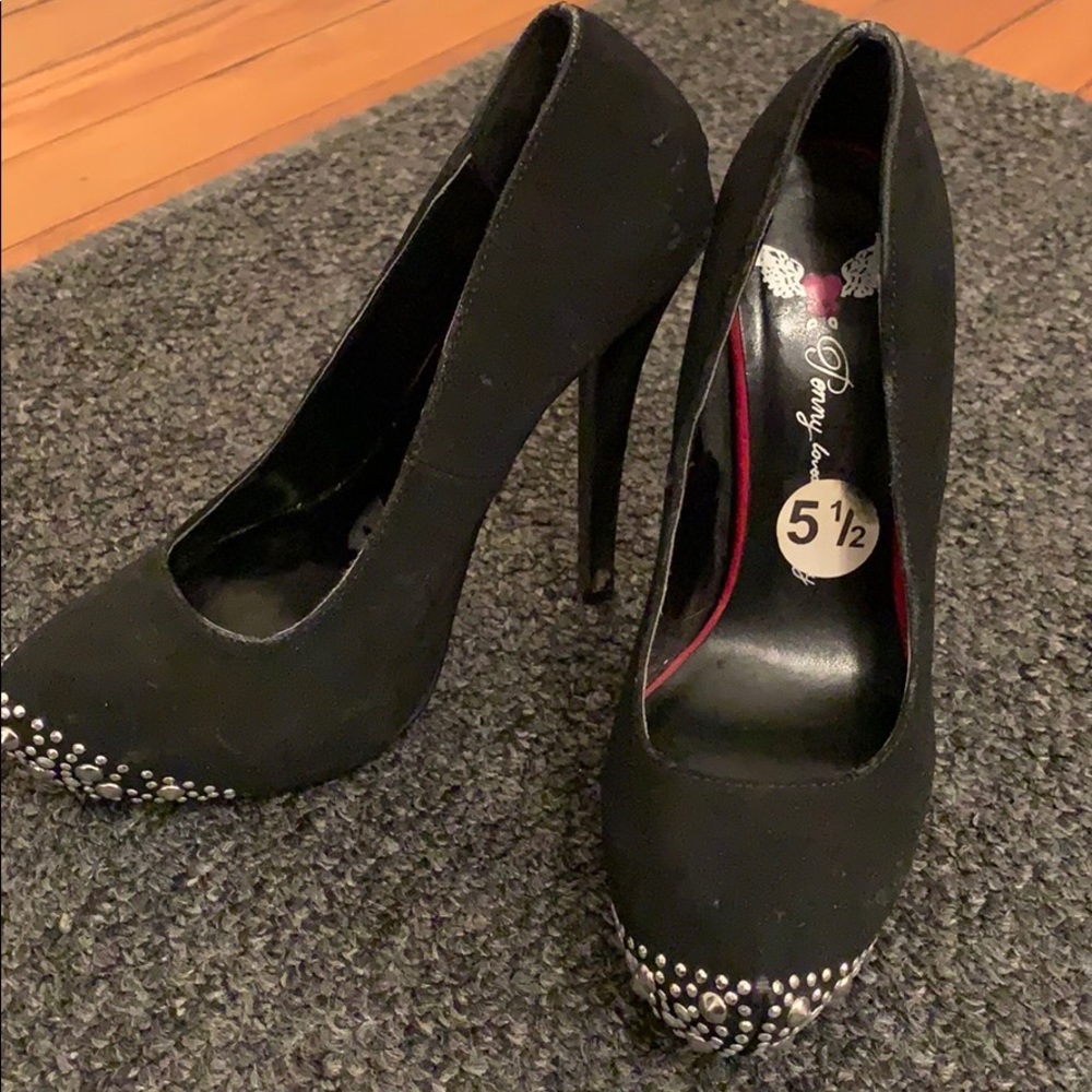 Black heels with silver rhinestones at the toe